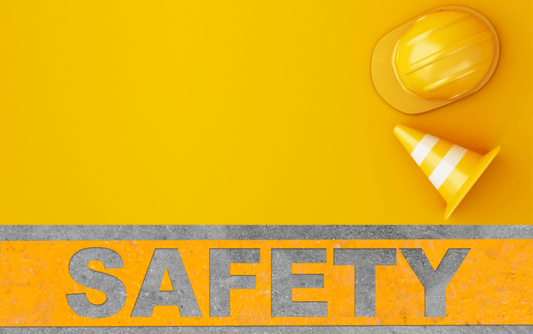 Safety word with hard hat and traffic cone in color yellow background