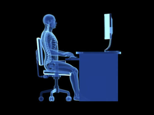 image of a human working on computer