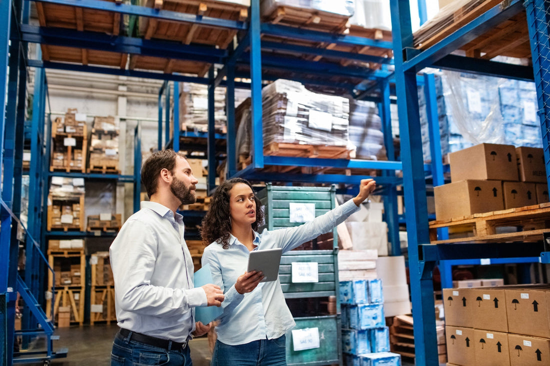 Two people discussing inside the factory