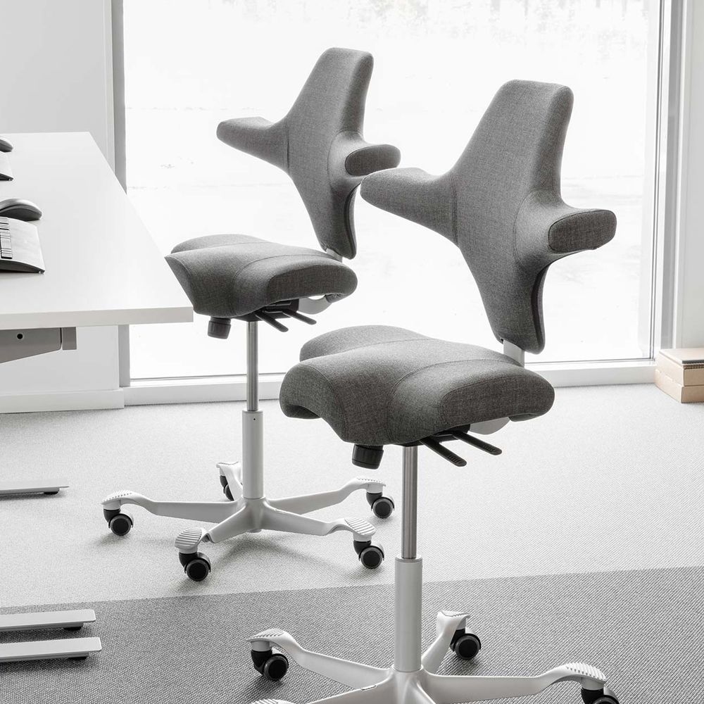 Gray office chairs with white bases in a modern office setting