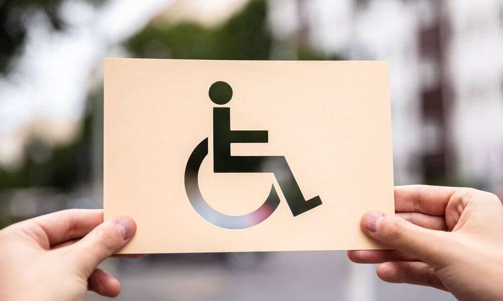 disable signage hold by a hand