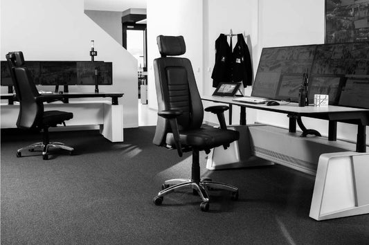Office set up with ergonomic computer chair in black and white
