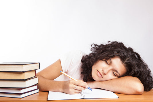 Woman sleeping on work