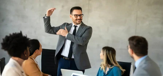 A manager teaching his colleagues