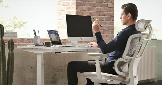 a man sitting on a ergonomic chair