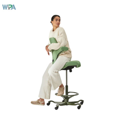 Person sitting on a green ergonomic chair with WPA logo in the corner