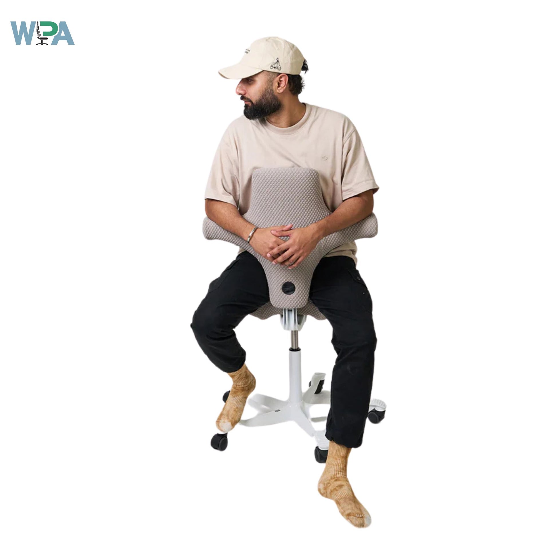 Man sitting on a unique chair with a white background