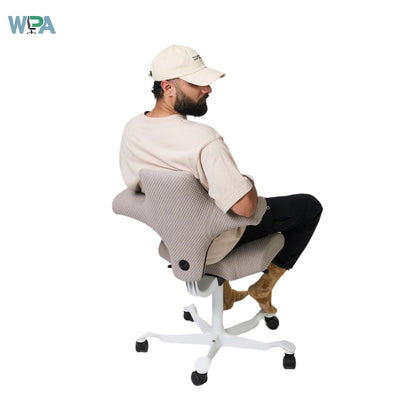 Person sitting on a ergonomic chair with WPA logo in the corner