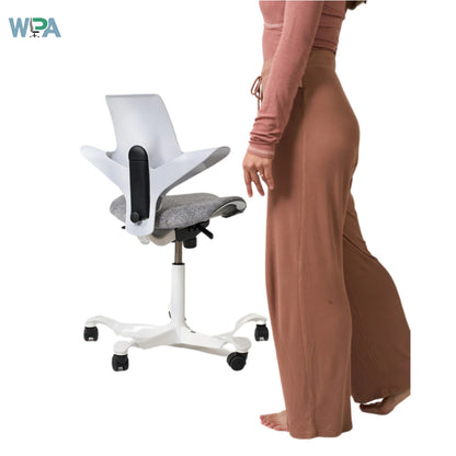 White office chair with adjustable features next to a person wearing brown pants on a white background