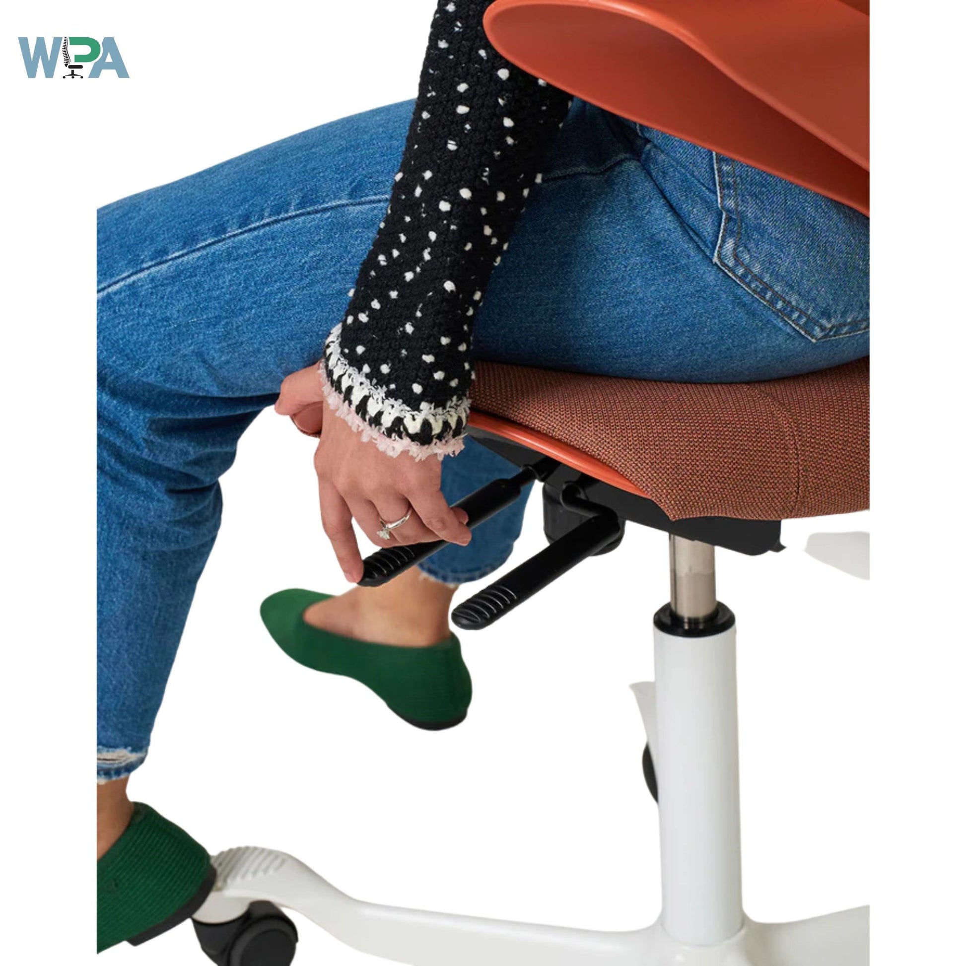 Person using a footrest on a chair with Wpa logo