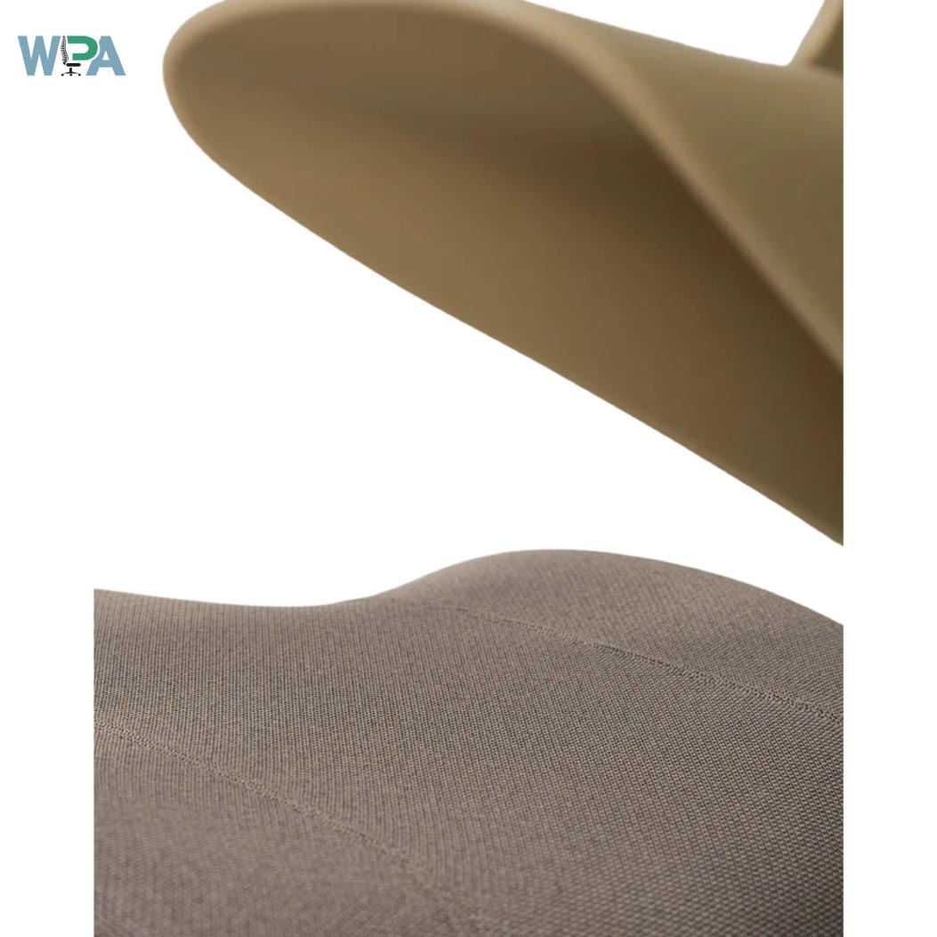 Close-up of a beige chair with a WIRA logo in the corner.