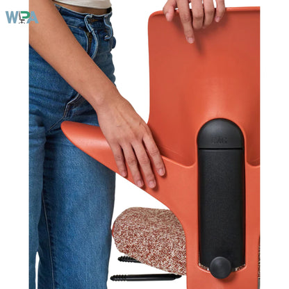 Person holding a red office chair with a black seat pad, Wpa logo visible