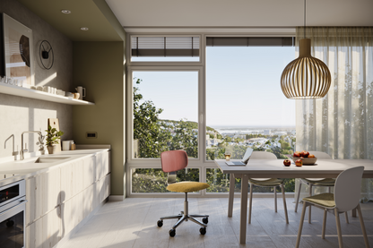 Modern kitchen with a dining area and large windows overlooking a scenic view.